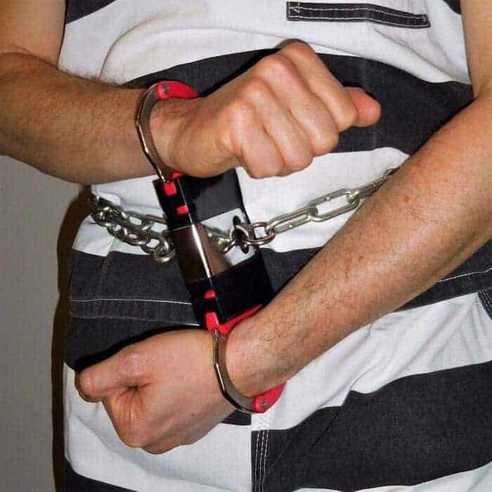 img 7893 Mass incarceration close-up of a handcuffed inmate