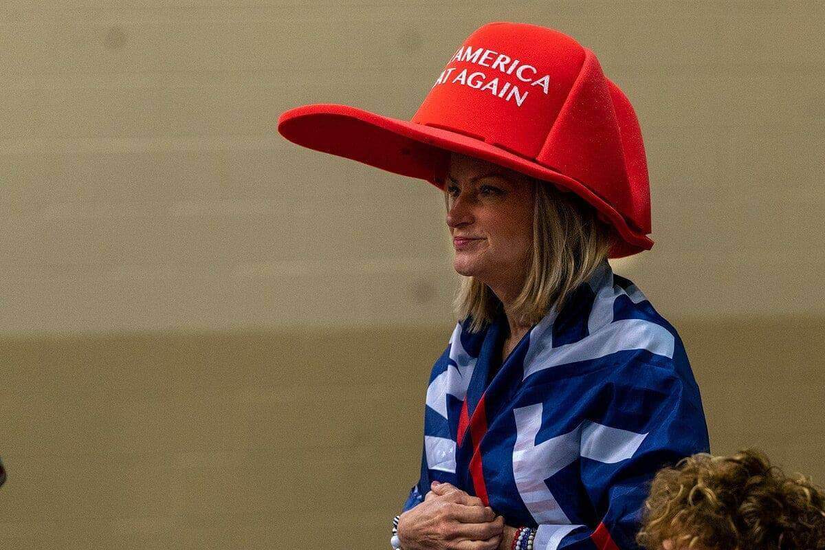 img 8167 Maga woman wearing an oversized red maga hat in florid