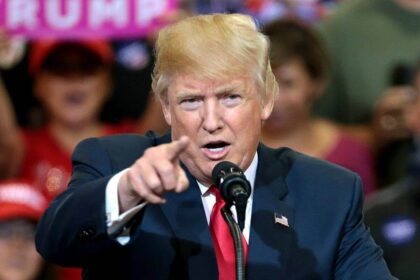 President-elect trump, at the time a candidate at a rally pointing at the camera