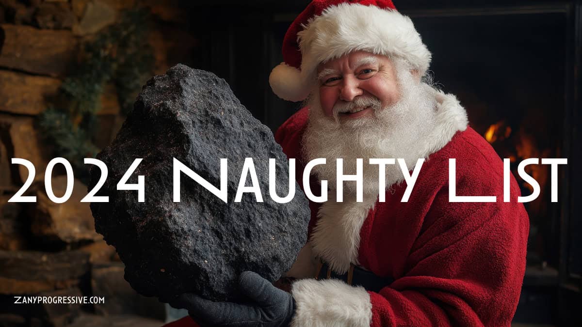 Santa holding a giant lump of coal by the fireplace