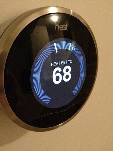 smart thermostat Eco-friendly smart thermostat on a wall by nest