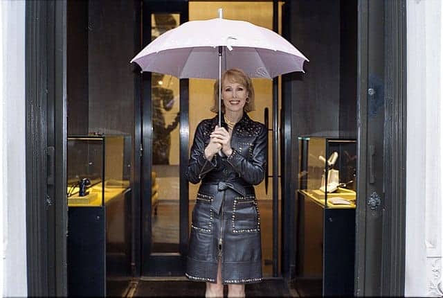 E. Jean carroll holding an umbrella as a young woman in new york