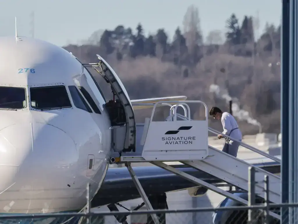 detainee boarding plane Ice air detainee boarding a plane in shackles