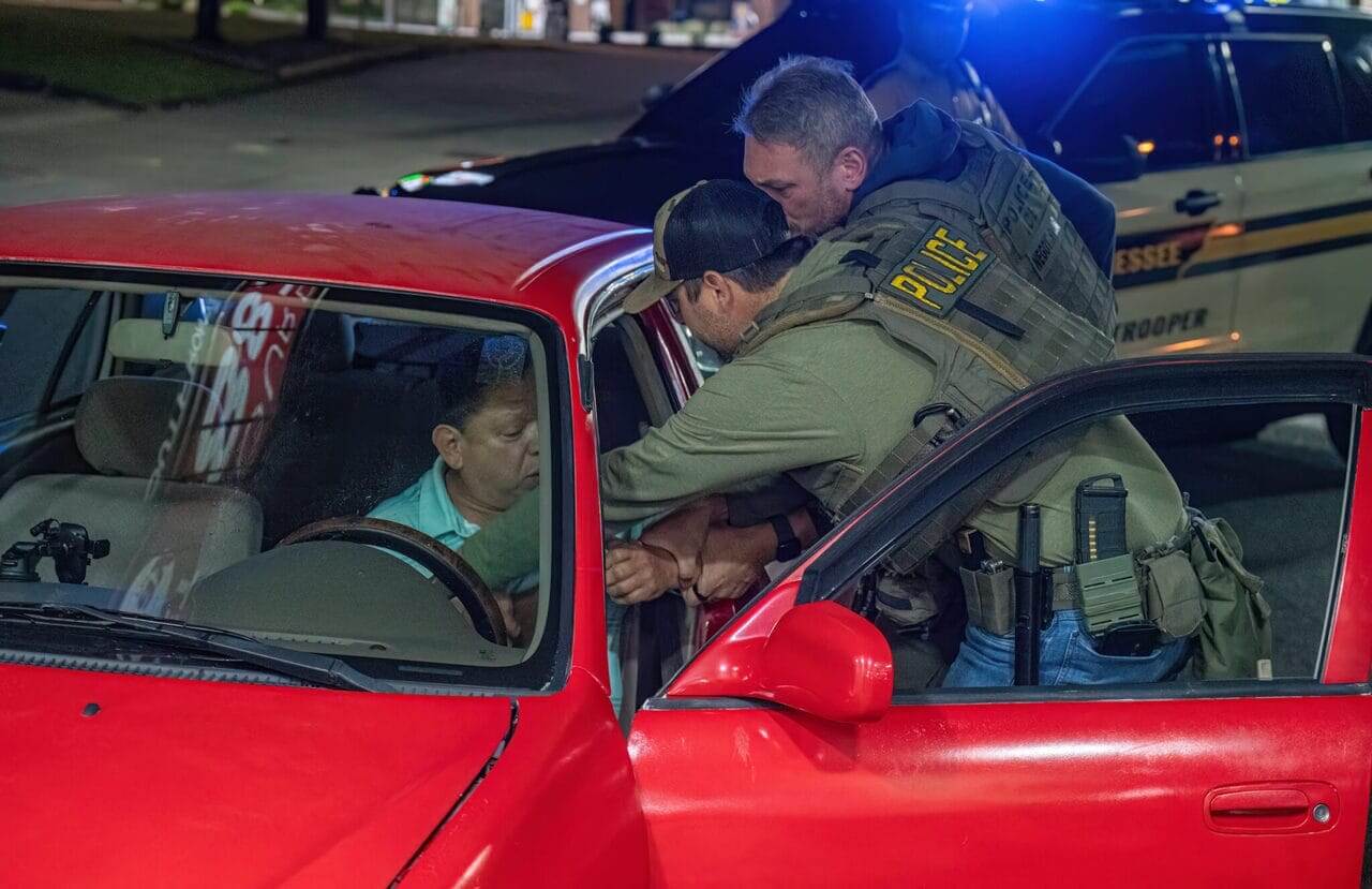 ice agents reach into car Agents from the immigration and customs enforcement agency reach into a car to pull a driver out on may 9, 2025 in nashville.