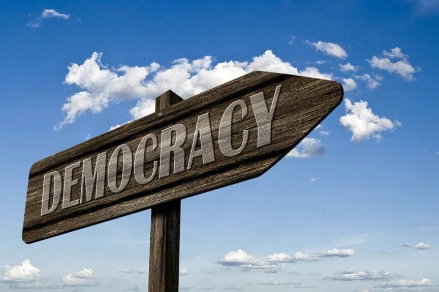 Overturn election Wooden democracy sign with a blue sky in the background democracy quiz