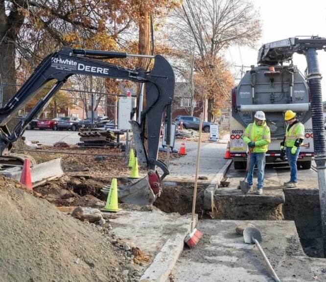 men hardhats working Men in hard hats working on geothermal energy infrastructure.