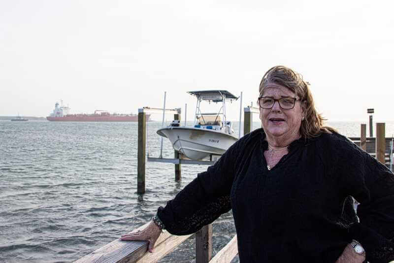 suzie wilder standing on dock Suzie wilder on dock