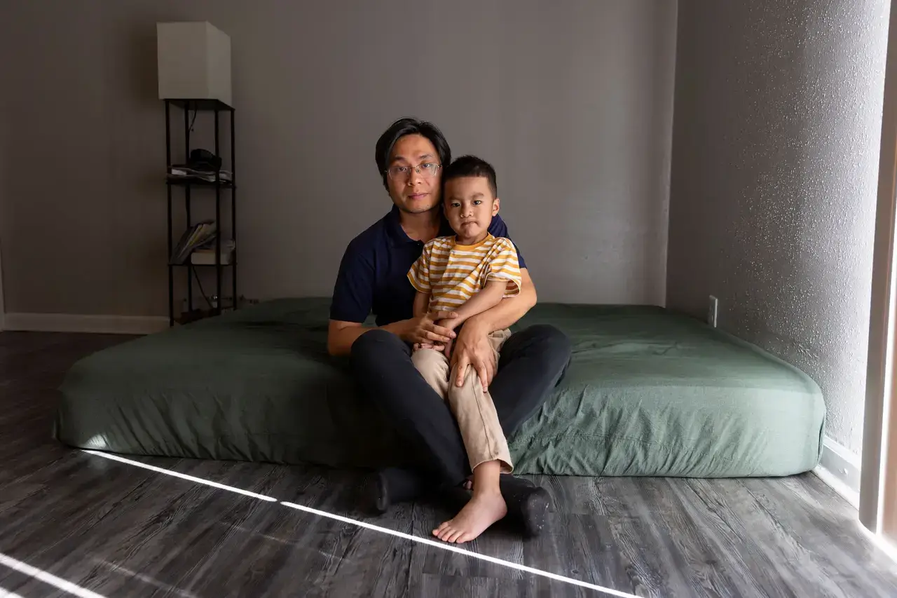 Texas boy sitting in the lap of his father