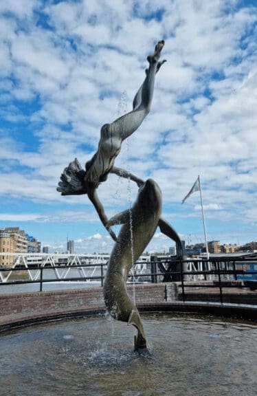 london statues6 A statue of a woman with a dolphin