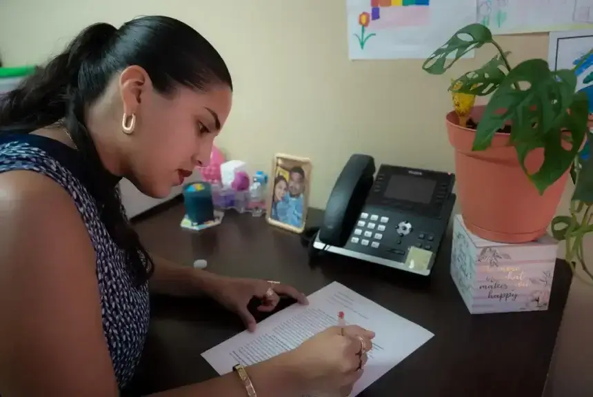 daca student texas Katerin edits her schoolwork in her houston office on aug. 17, 2025. She works full-time as a case worker while also balancing a masters program in social work.