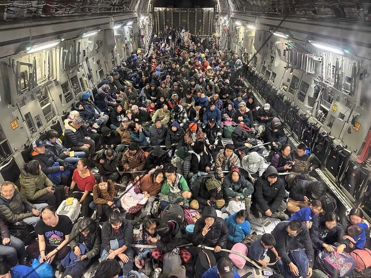 People evacuated by national guard from alaska after typhoon hit.