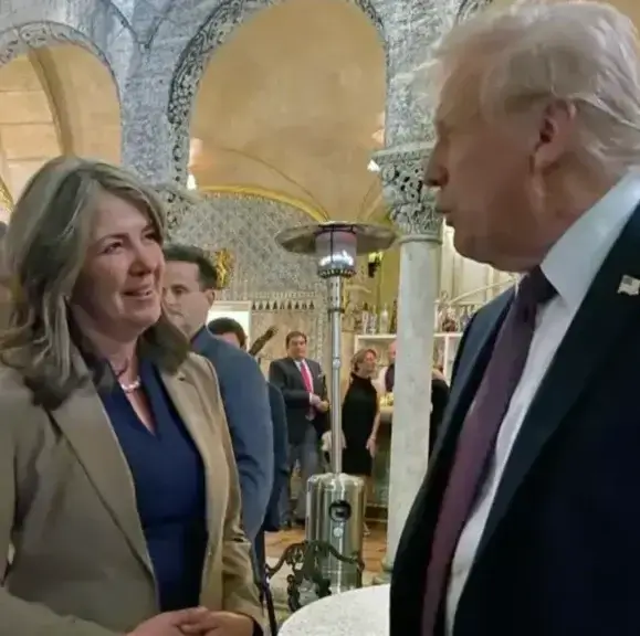 two politicians talking Alberta premier danielle smith visits trump at mar-a-lago.
