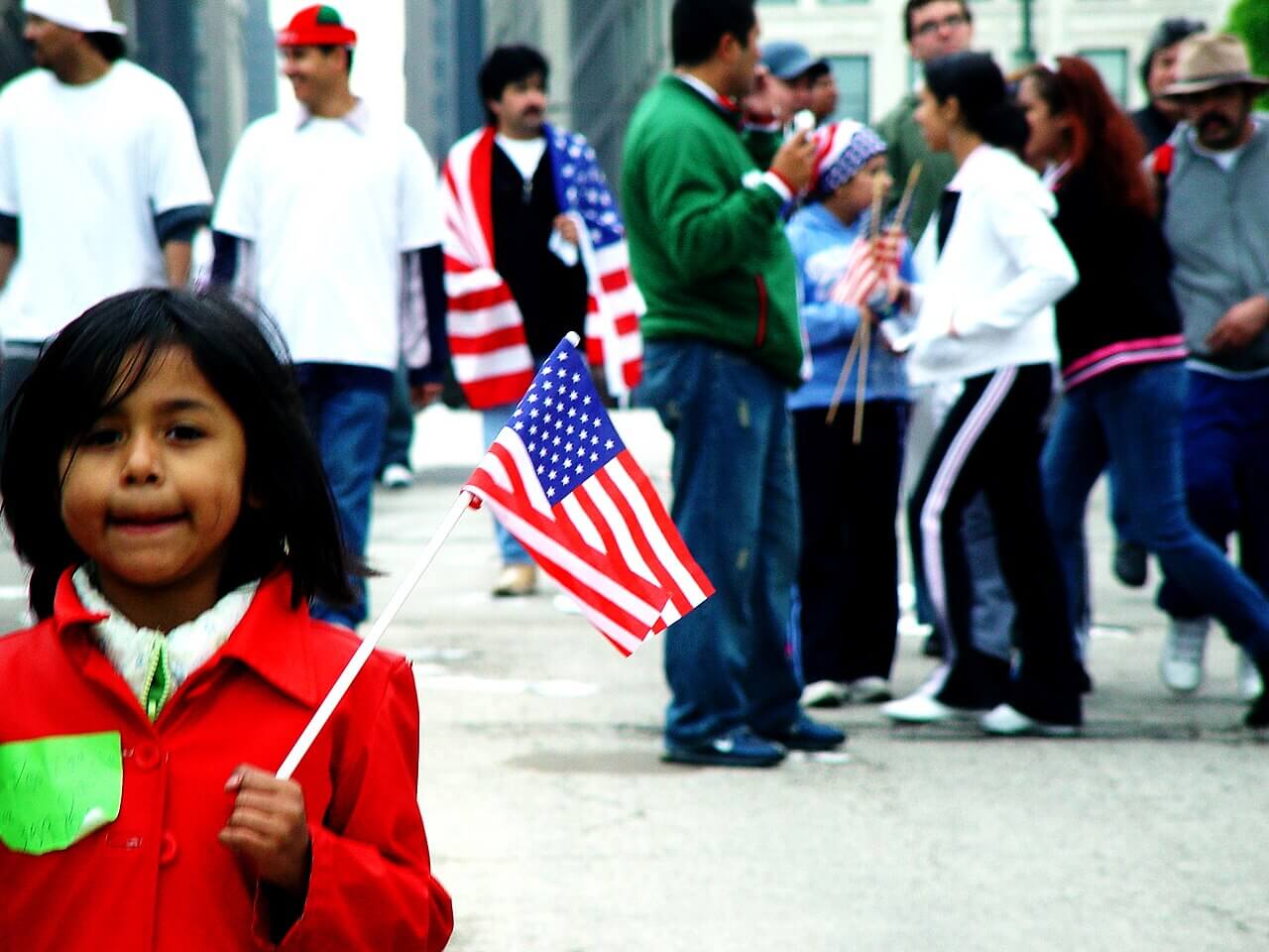Cbp agents are back in chicago. A little girl holding an american flag at a 2006 immigration protest in chicago