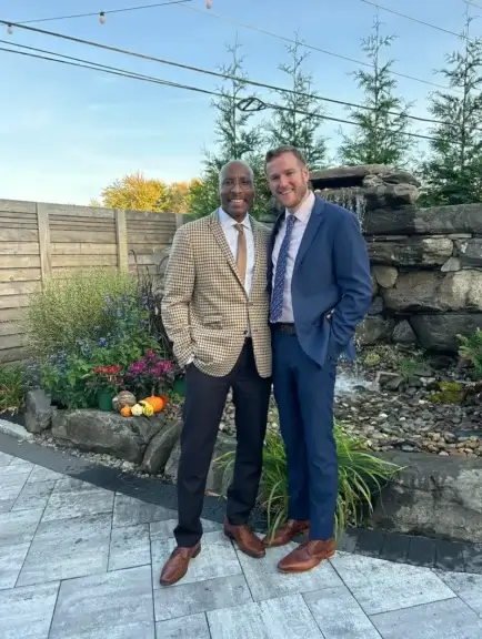 handsome couple Men wearing suits posing together. Great looking couple.