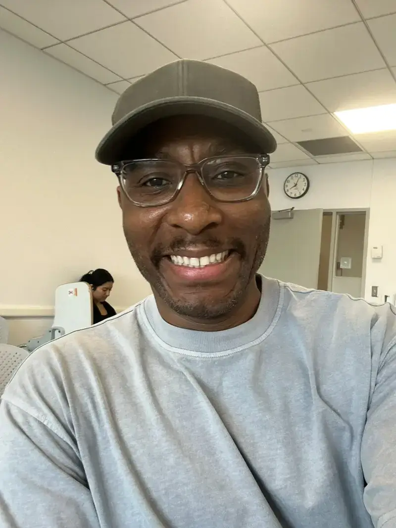 handsome fella Hiv anxiety in dating. Handsome man in a baseball cap and glasses smiling