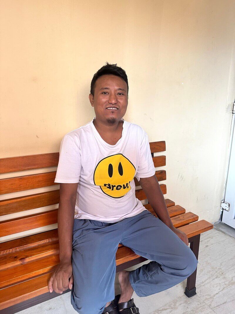man posing bench Migrant workers posing on bench