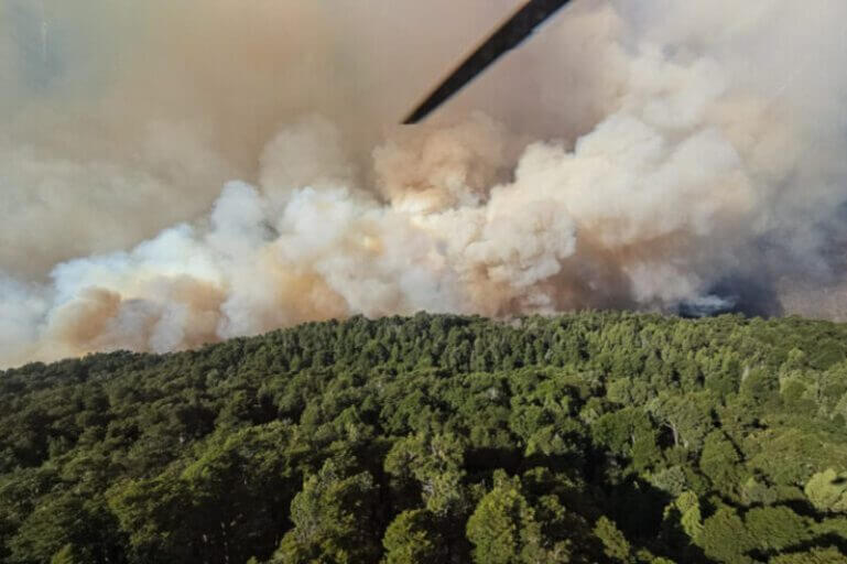 smoke argentina Fires in argentina smoke rising over green hillsides