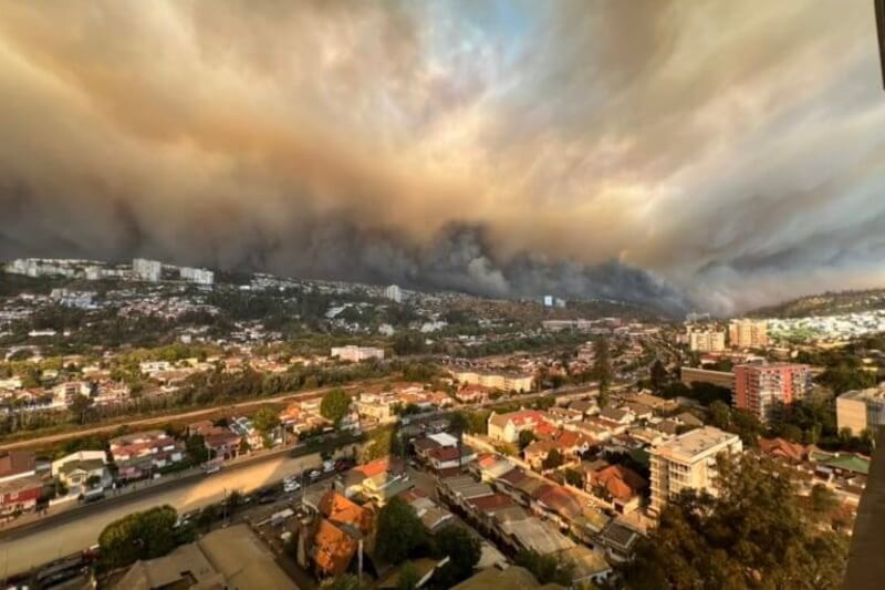 view abive city smoke View of chile city from above with wildfire smoke on the horizon