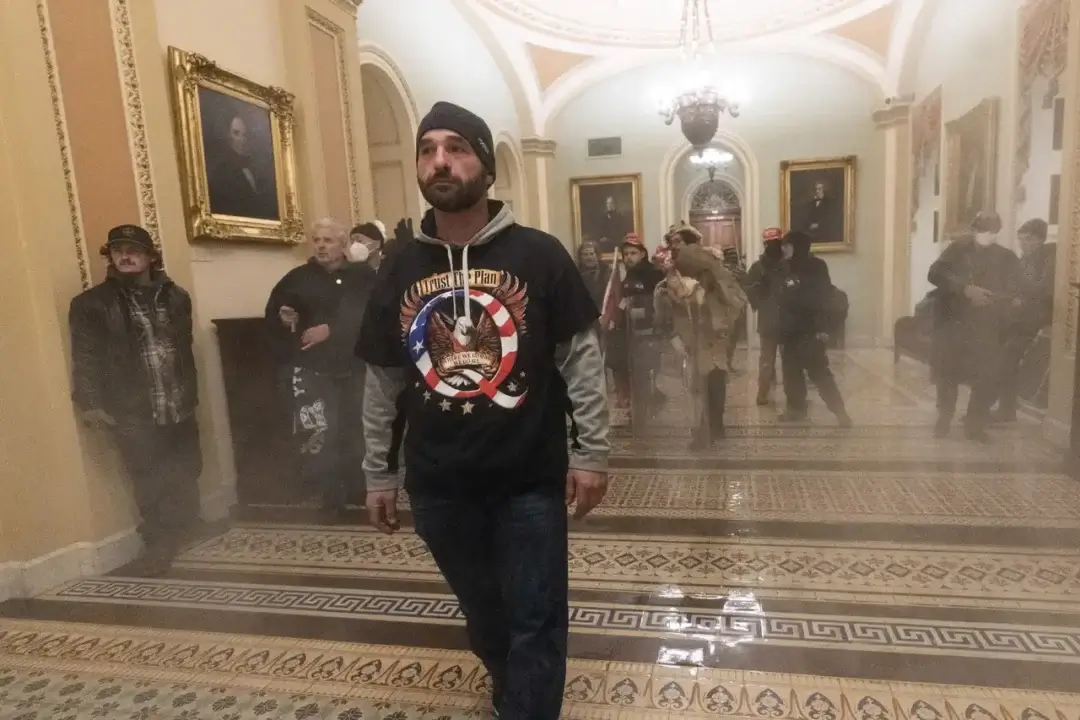 douglas jensen ap image resized Douglas jensen wearing a qanon shirt, believed in the deep state