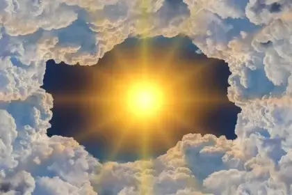 Sun shining through clouds and greenhouse gases