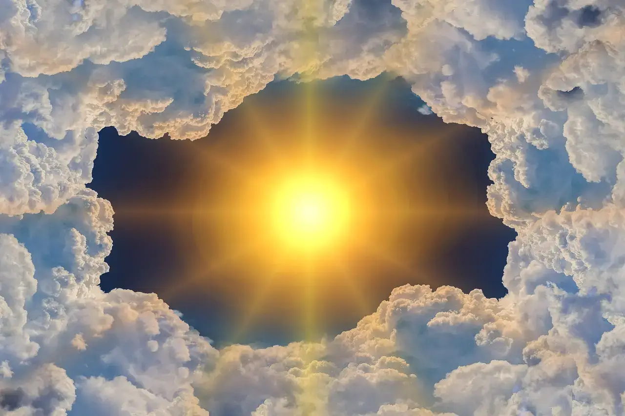 Sun shining through clouds and greenhouse gases