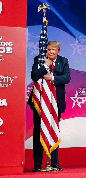 trump hugging flag Fascist president hugging the american flag
