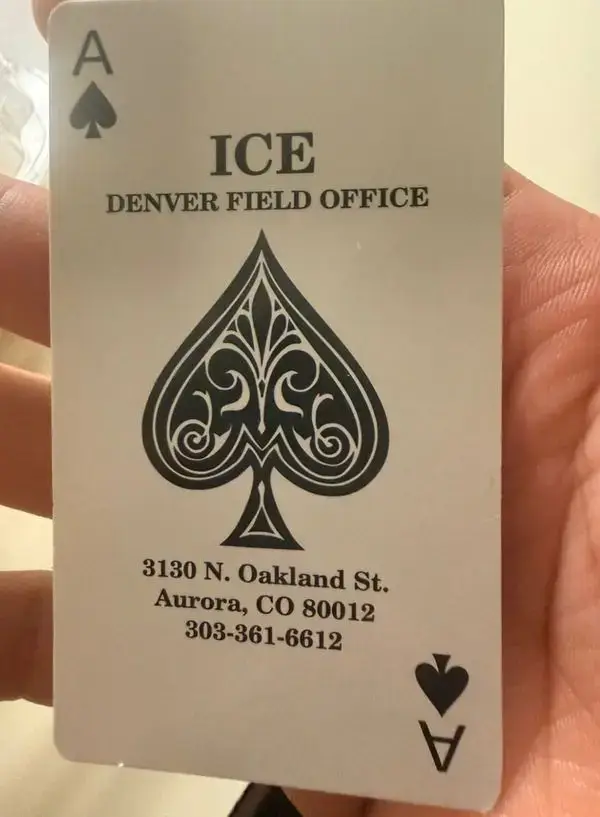 A hand holding one of the ice death cards. Ice agent involved in the maine shooting
