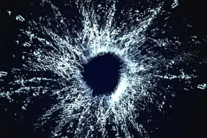 Gun laws by country image of a bullet hole in glass