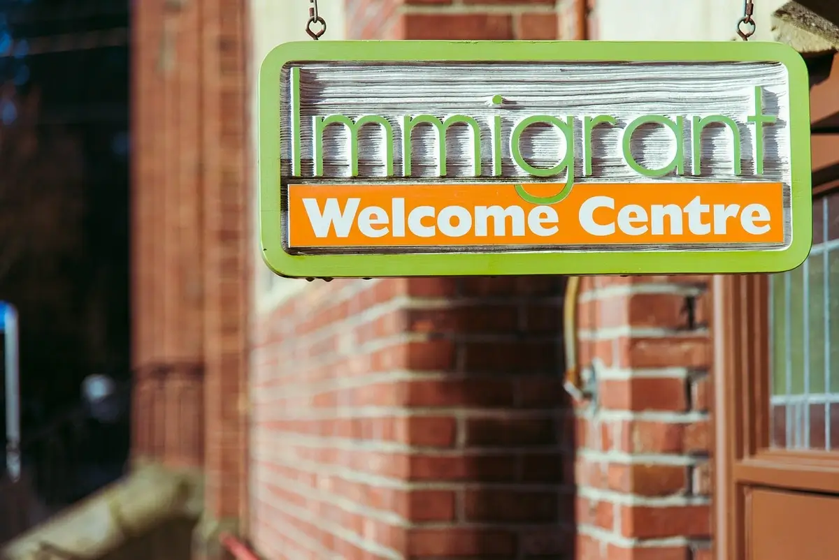 vlad vasnetzov immigrants welcome Immigrants welcome center sign temporary protection status