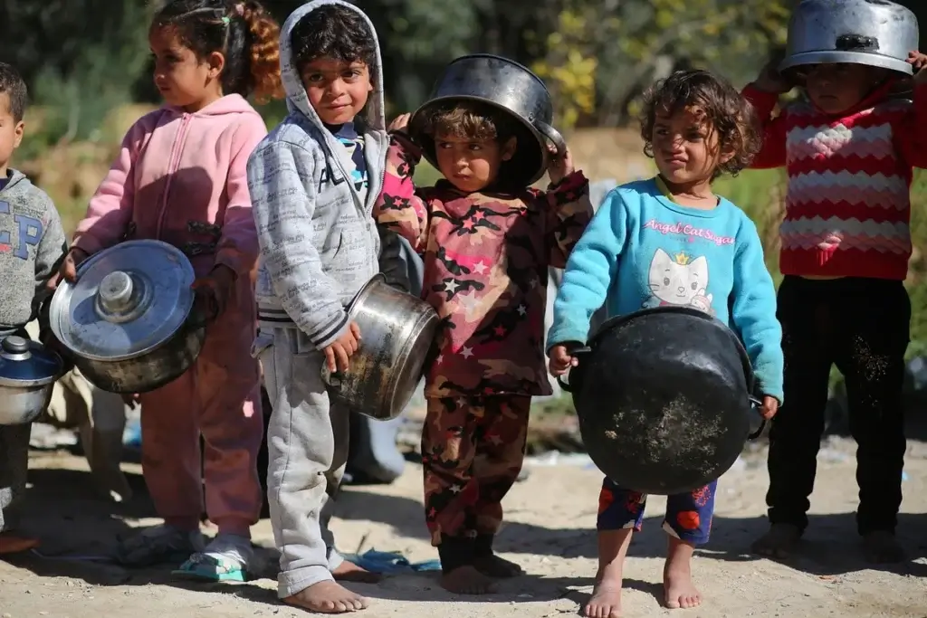 children in food line gaza Children in gaza genocide wait in a line for food. Violence in gaza continues