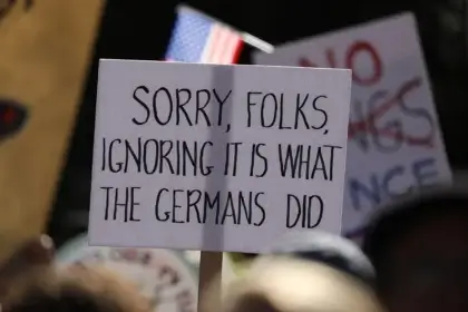 No kings iii protest sign about nazi germany. Fascism in america