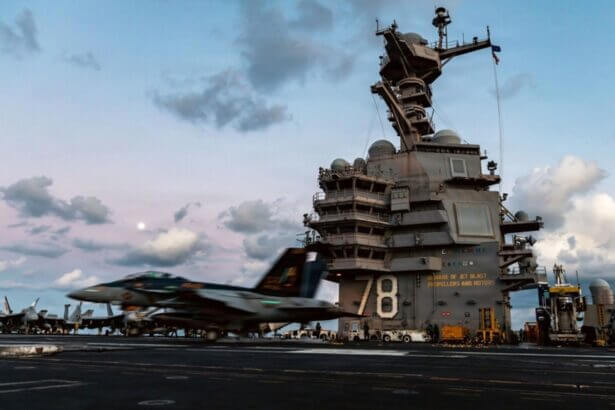 An f/a-18f super hornet aircraft lands on the flight deck of the uss gerald r. Ford in support of operation epic fury in the eastern mediterranean sea