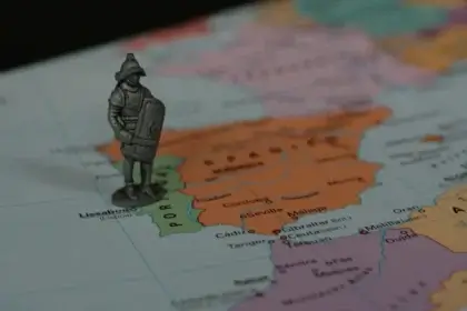 Ancient metal soldier on a map of the world. Section 219