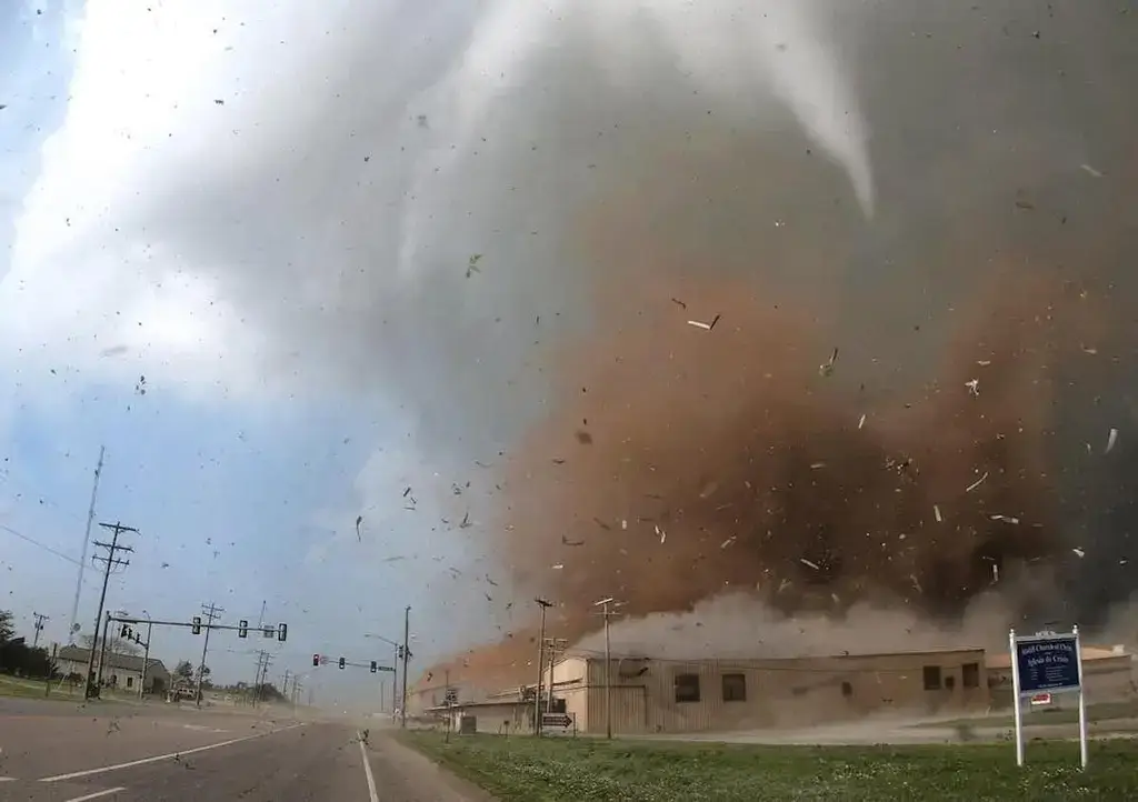 tornado image2 Tornado with debris swirling around near the ground