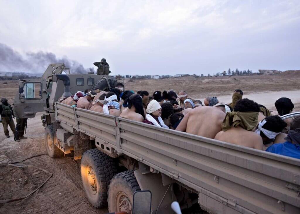 Truck full of palestinian prisoners, some who were victims of the torture in israeli prisons