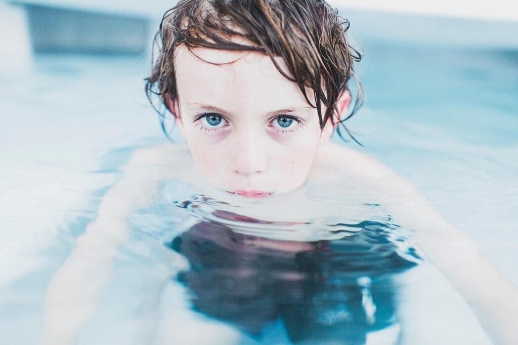 Racial disparities in drowning deaths. A boy in a swimming pool