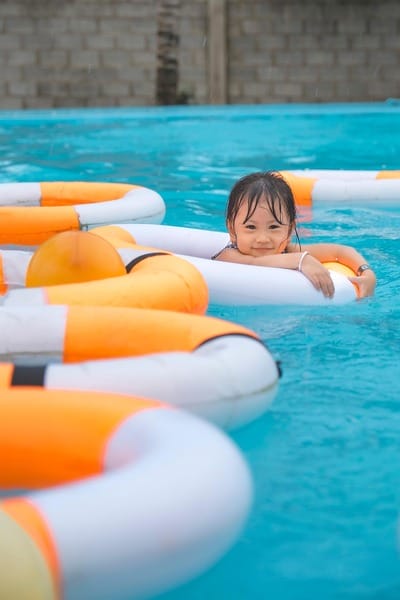 Racial disparities in drowning. A girl in a pool using a floatie