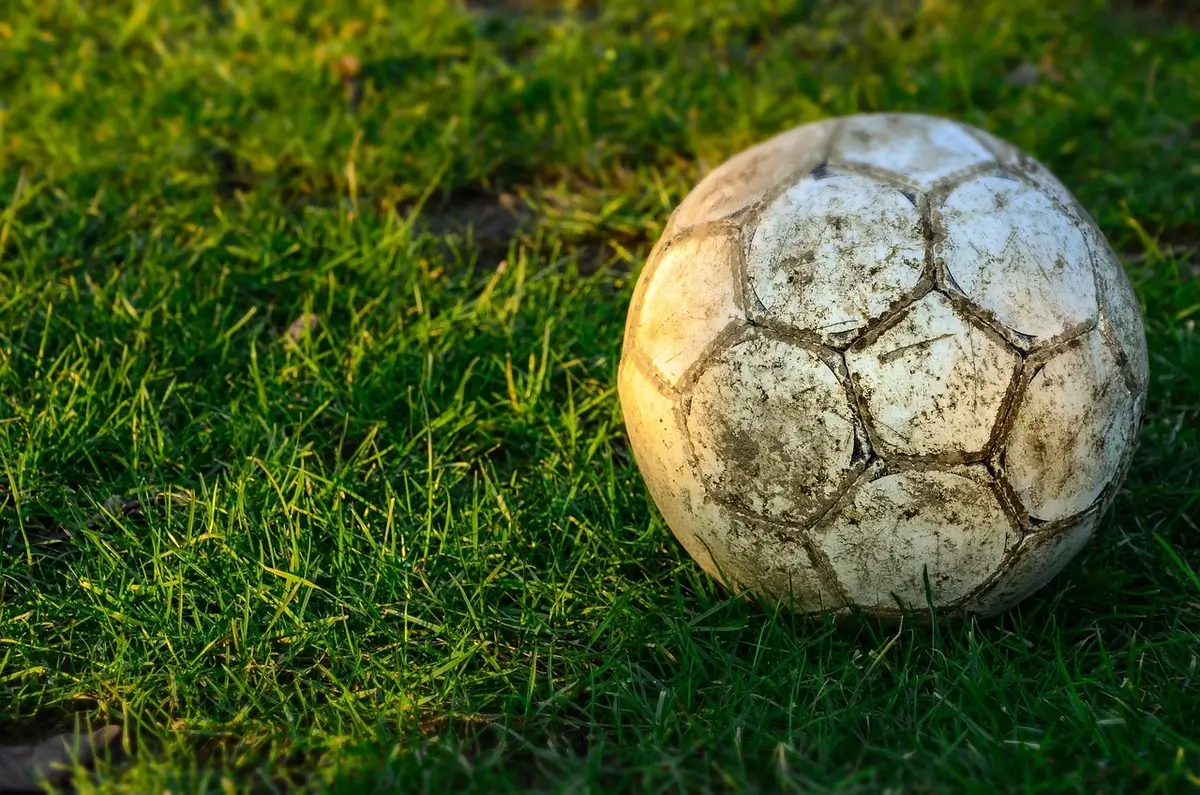 2026 fifa world cup disaster. A muddy soccer ball in the grass