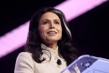 Cult leader controlled tulsi gabbard, seen here speaking at a convention in arizona