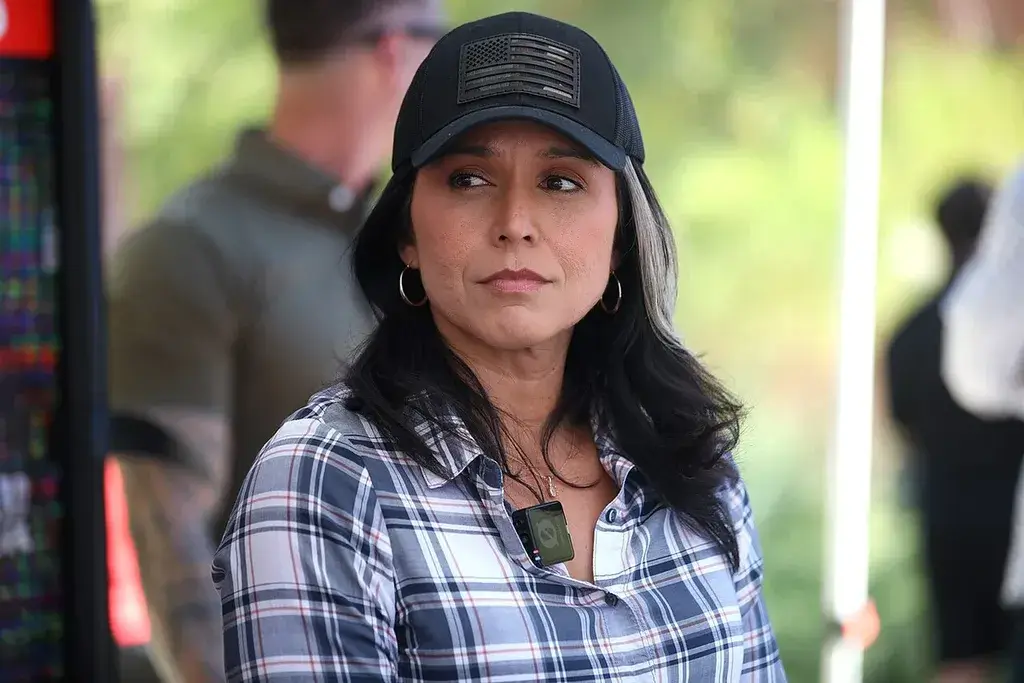 Tulsi gabbard wearing a baseball cap