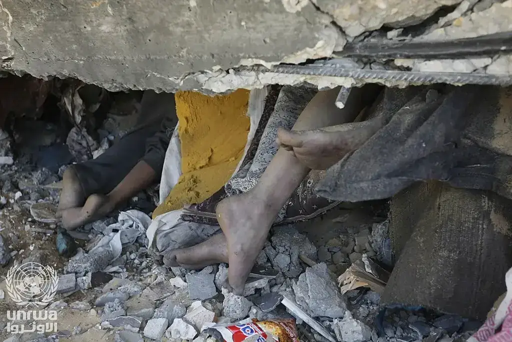 In gaza, bare feet stick out from under the rubble of a house after an israeli airstrike. The missing in gaza may be under rubble or in prison.