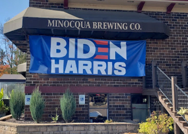 minocqua biden banner A biden/harris banner hanging outside the minocqua brewery in wisconsin.