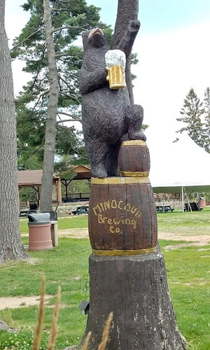 minocqua brewery bear Wooden bear carving holding a mug of beer at the minocqua brewing company in wisconsin.
