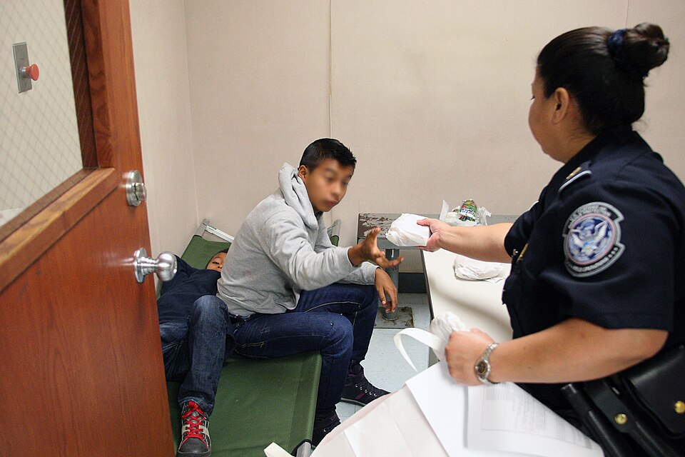 food to migrant child cbp A cbp officer offers food to an unaccompanied minor in texas.