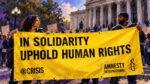 Amnesty international ice report calls to abolish ice yellow amnesty human rights banner