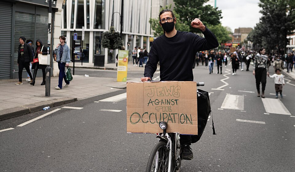 jews against israeli occupation A protester with a sign that says, “jews against the occupation…” referencing israel’s occupation of palestine